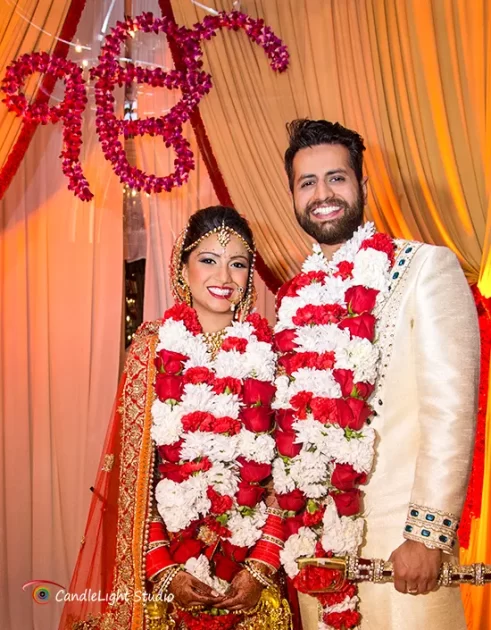 Skillful photographers capturing a Punjabi wedding ceremony in full swing.