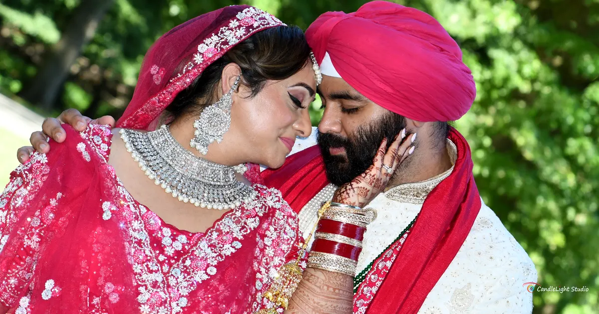 Sikh couple in traditional attire during their wedding ceremony captured by Candlelight Studio