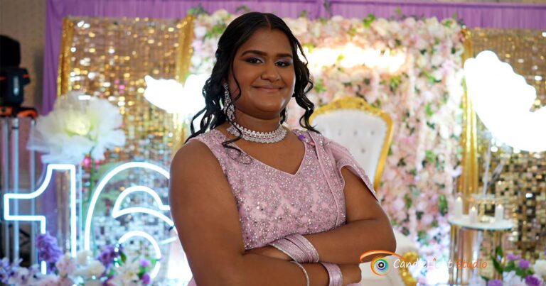 Eshika cutting her multi-layered purple butterfly cake during her Sweet 16 celebration, surrounded by friends and family, captured by CandleLight Studio.