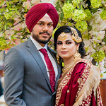 Top Punjabi Wedding Photographers in New York | CandleLight Studio Bride dressed in red lehenga posing before Punjabi wedding
