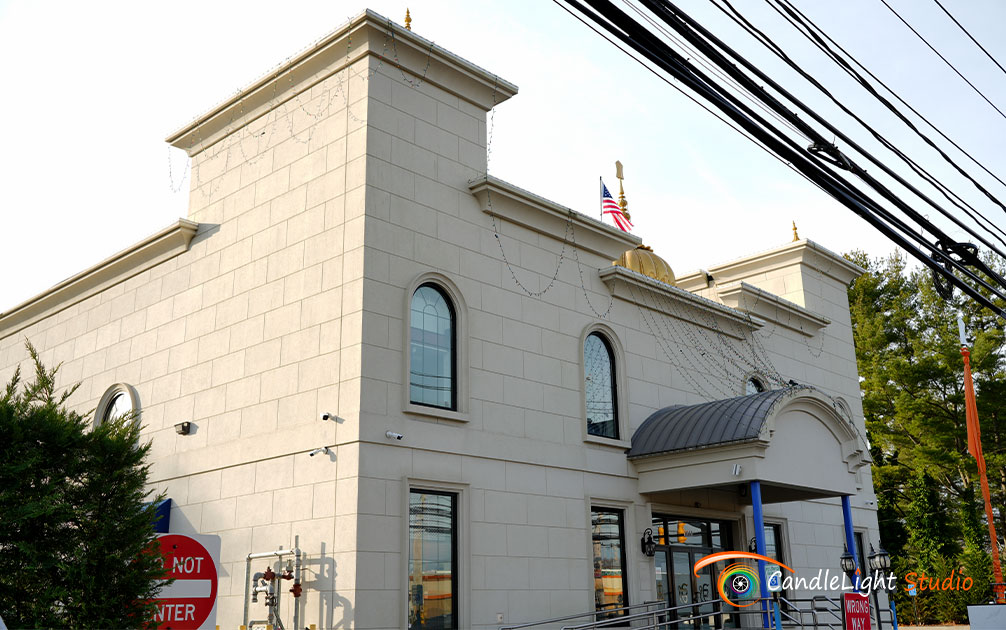 Exterior view of the Guru Gobind Singh Sikh Center in Plainview, NY, a serene location for Punjabi Sikh weddings, captured by CandleLight Studio.