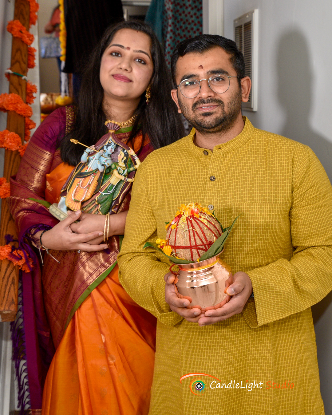 Event photography of a housewarming pooja, capturing family prayers and blessings during the ceremony.