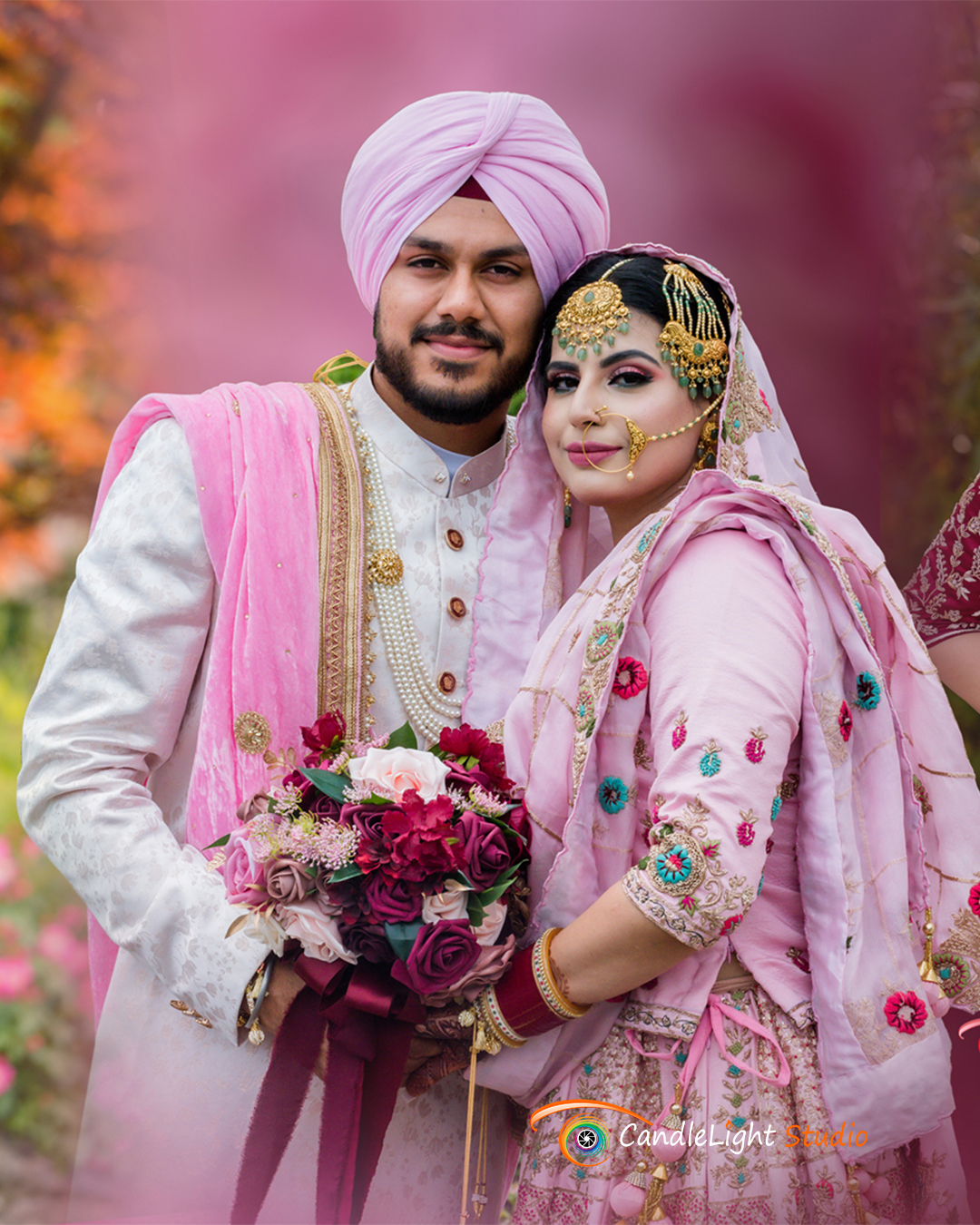 Punjabi bride and groom posing together in traditional wedding attire during a New York Sikh wedding