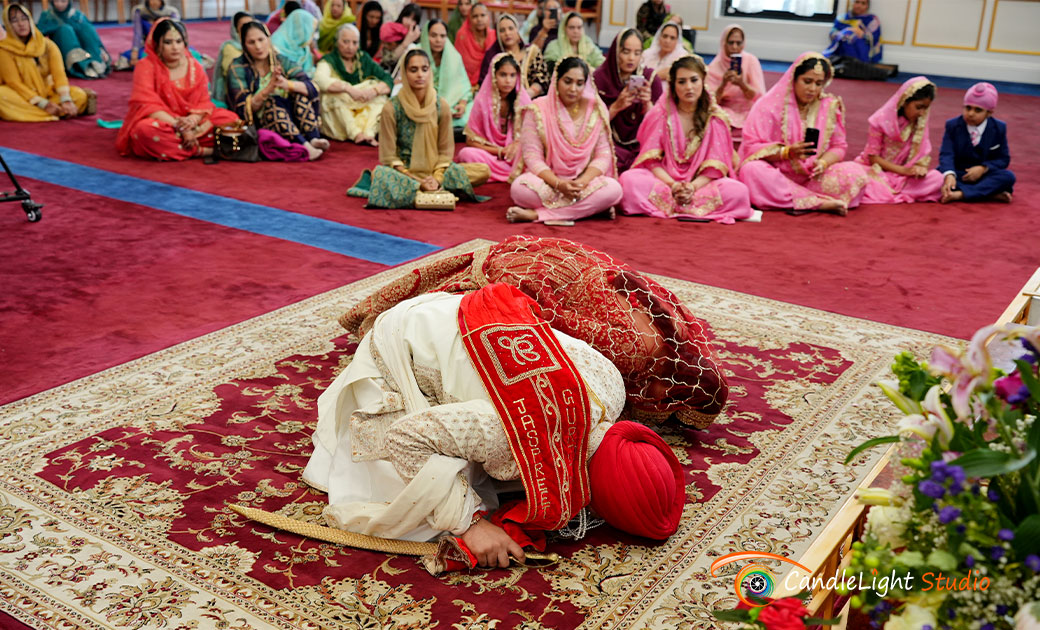 Gurjit and Jaspreet are walking around the Guru Granth Sahib during their Lavaan Anand Karaj ceremony at the Guru Gobind Singh Sikh Center, Long Island.